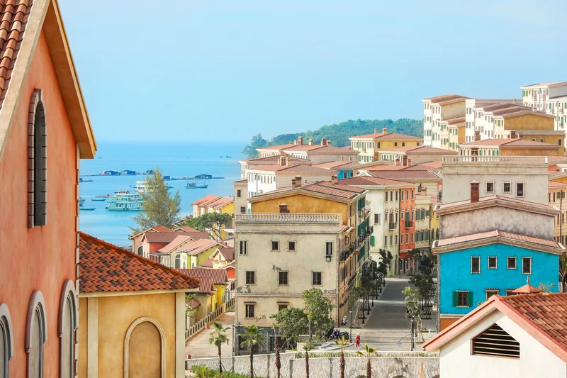 Colorful Mediterranean-style buildings line a hillside street overlooking the sea in Phu Quoc.
